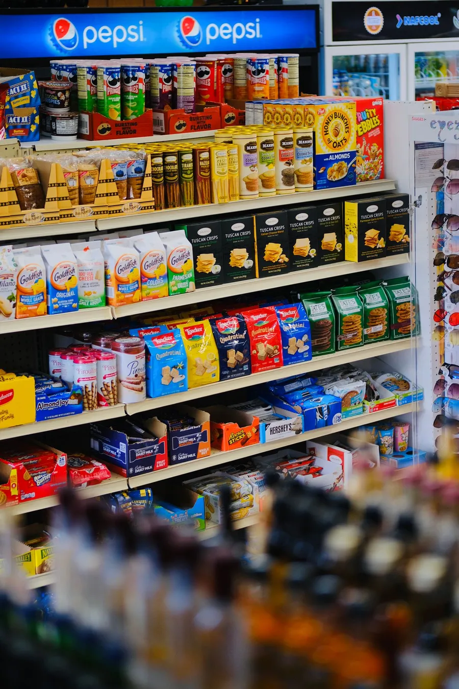 A colourful selection of packaged snacks and chocolate, shown as category inspiration